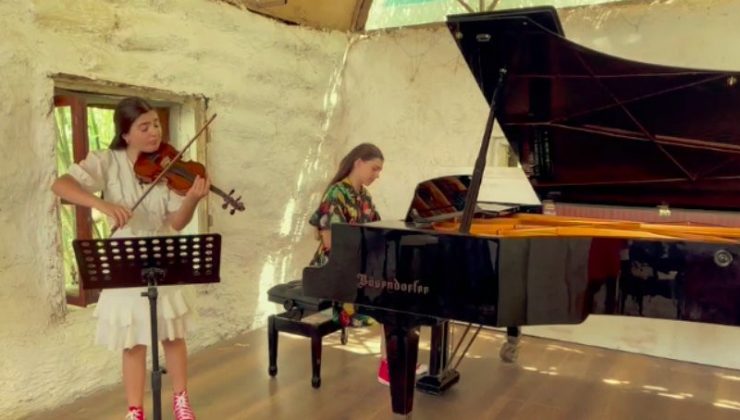 İki genç müzisyen yanan ormanlar için çaldı